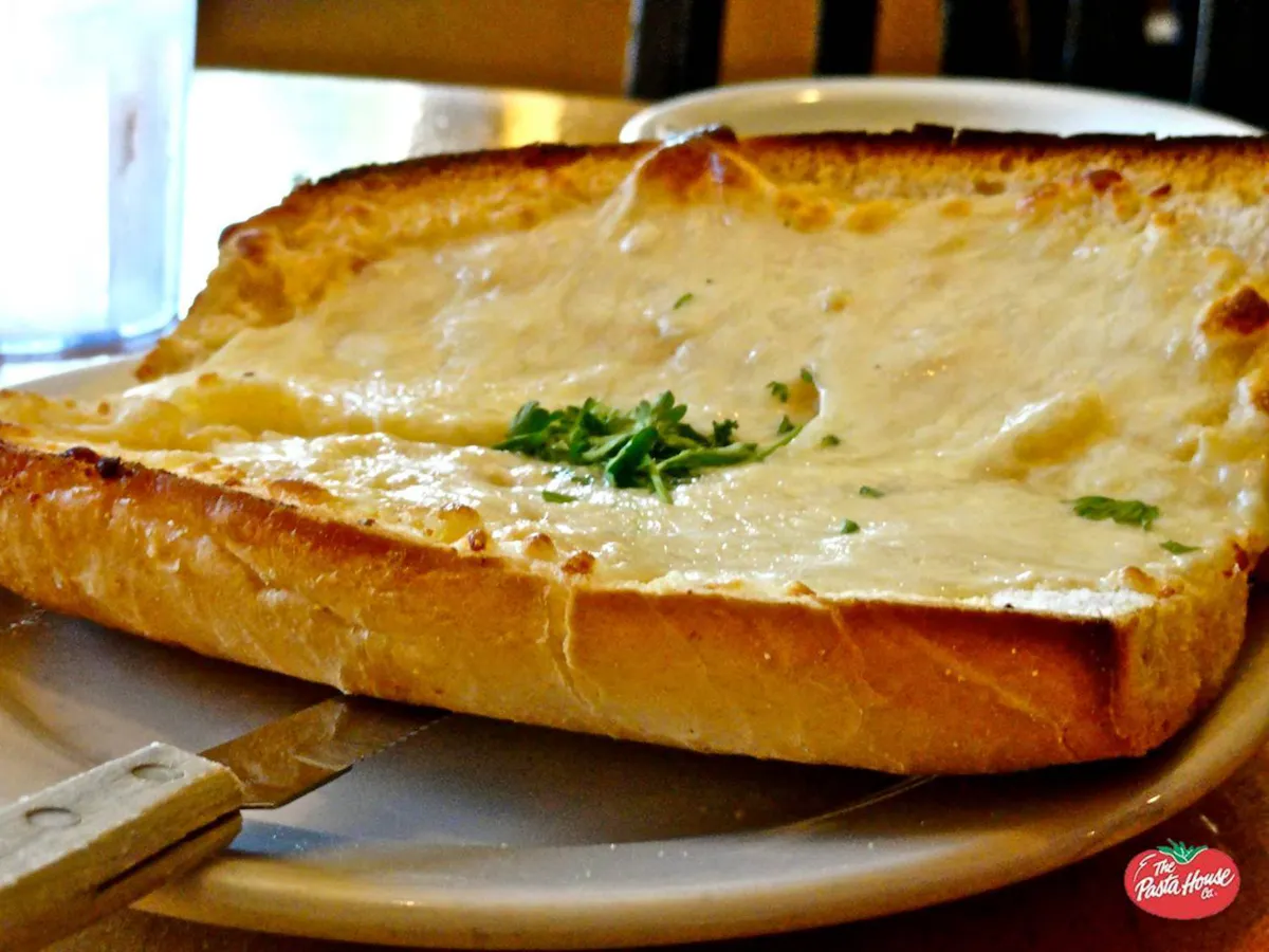 a piece of garlic bread on a plate